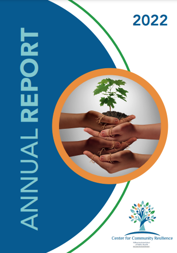 report cover featuring an orange circle with a photo of stacked hands holding a sapling tree