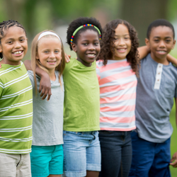 Multiracial group of five small children between ages 5-7 years old